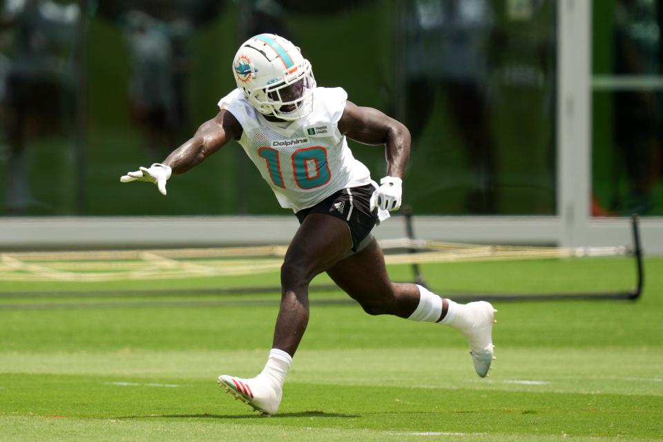 May 17, 2022; Miami Gardens, FL, USA; Miami Dolphins wide receiver Tyreek Hill (10) runs a drill during OTA practice at Baptist Health Training Complex. Mandatory Credit: Jasen Vinlove-USA TODAY Sports