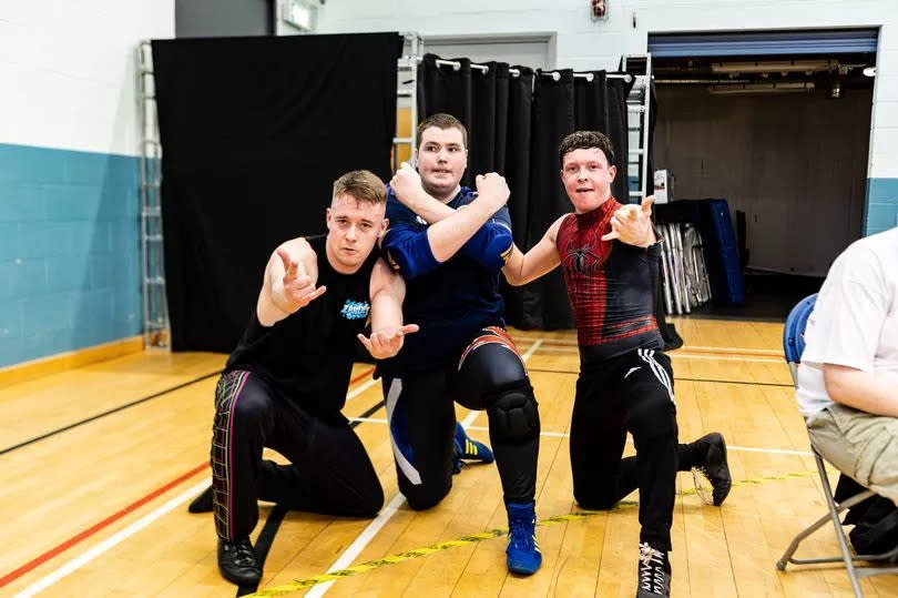 Paul (middle) wrestled alongside his heroes - The Govan Team -Credit:Kyle Watt