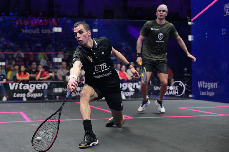 Squash men's world No.1 Ali Farag (left) returns a shot as world No.2 Diego Elias looks on during their Singapore Squash Open final. (PHOTO: Vincent Thian/Singapore Squash Open)