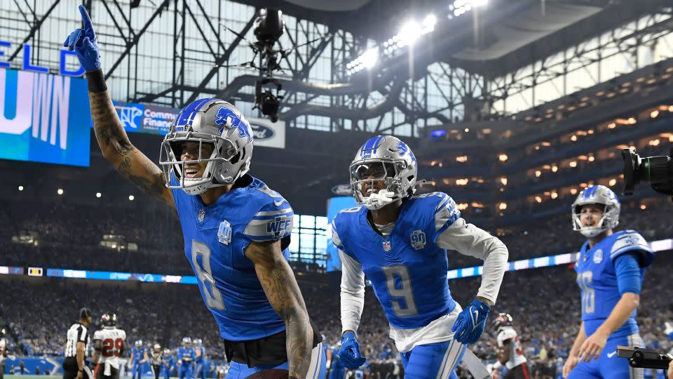 Detroit Lions wide receiver Josh Reynolds celebrates with teammates Jameson Williams and Jared Goff after scoring a touchdown against the Tampa Bay Buccaneers on Sunday. - Jose Juarez/AP