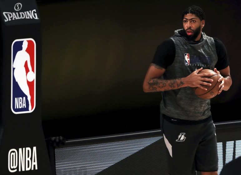 Los Angeles Lakes' Anthony Davis warms up prior to an NBA basketball game against the Los Angeles Clippers.