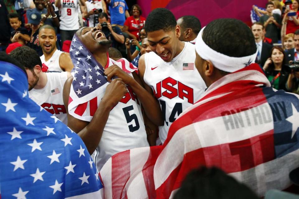 Team USA players Kevin Durant (left) , Anthony Davis (middle) and Carmelo Anthony celebrate after defeating Spain in the gold medal game at the London 2012 Olympic Games.