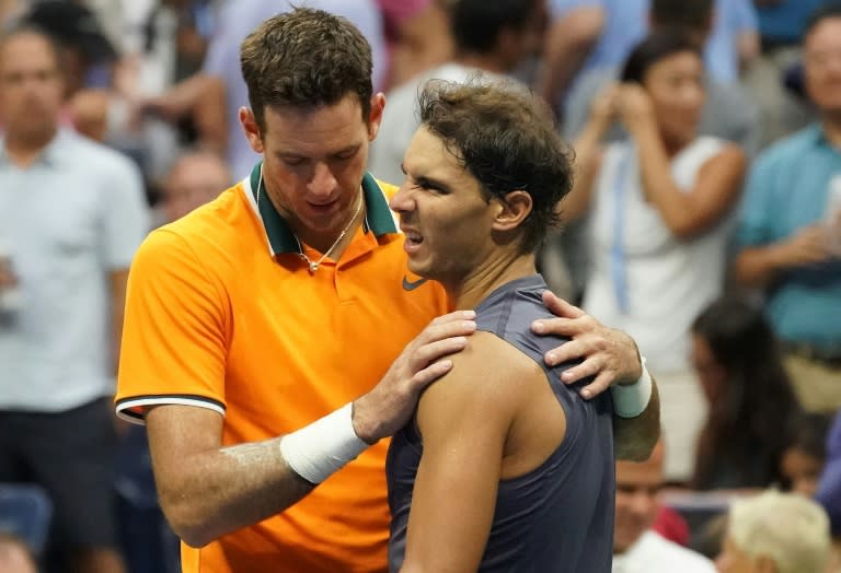 Consoling: Rafael Nadal with Juan Martin del Potro