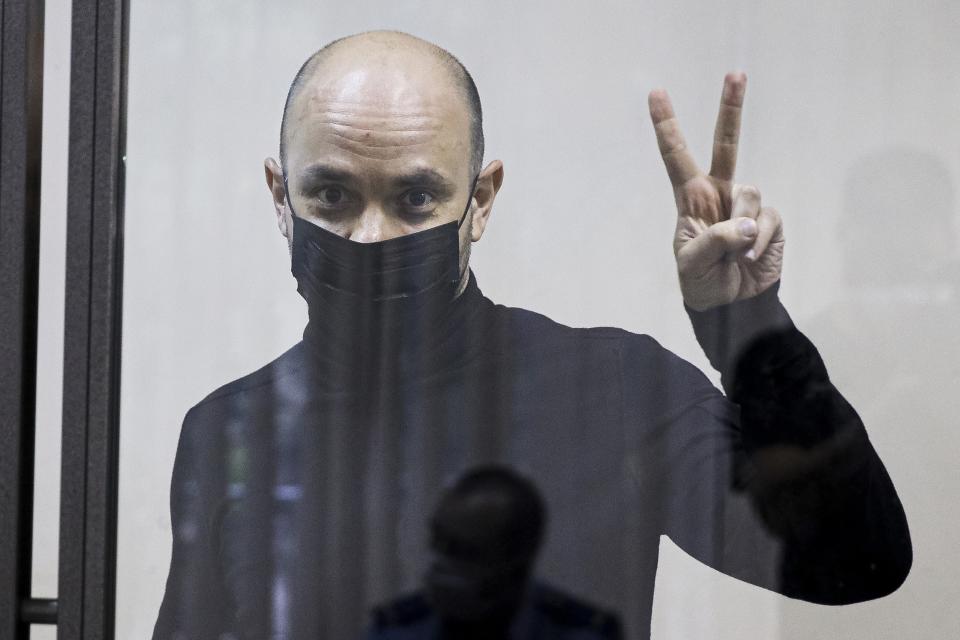 FILE - Andrei Pivovarov, former head of the Open Russia movement, gestures during a court session in Krasnodar, Russia, Wednesday, June 2, 2021. Pivovarov, former head of the Open Russia group, was sentenced to four years in prison for "directing an undesirable organization," a criminal offense under a 2015 law. His allies say he is being transferred to a prison to serve his sentence, and his whereabouts have remained unknown for a month. (AP Photo, File)