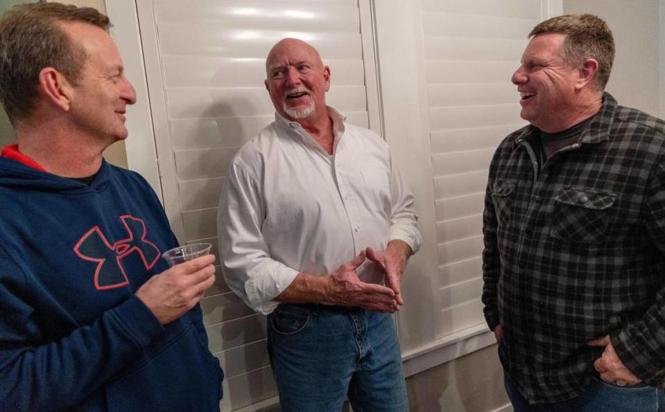 Eagle City Council President Brad Pike, center, talks with Jim Macfarlane, left, and Brian Sims, right, during his election night watch party at his home in Eagle, Tuesday, Dec. 5, 2023. Pike won the runoff election race for mayor of Eagle against incumbent Mayor Jason Pierce.