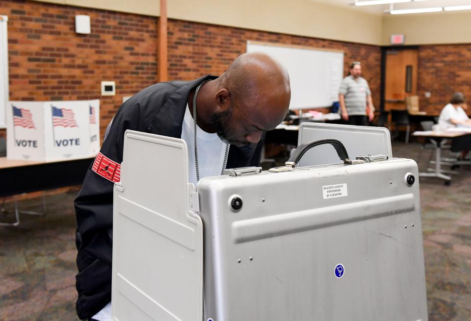 Torrance Rudd votes in the state-wide primary election on Tuesday, June 7, 2022, at the downtown branch of the Sioux Falls Public Library.