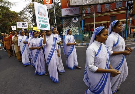 Catholic nuns from the Missionaries of Charity, the global order of nuns founded by Mother Teresa, take part in a rally to show solidarity with the nun who was raped during an armed assault on a convent school, in Kolkata March 16, 2015. REUTERS/Rupak De Chowdhuri