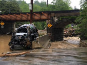 <p>A car left wrecked by flooding in Old Ellicott City. (Photo: Libby Solomon, Baltimore Sun via AP) </p>