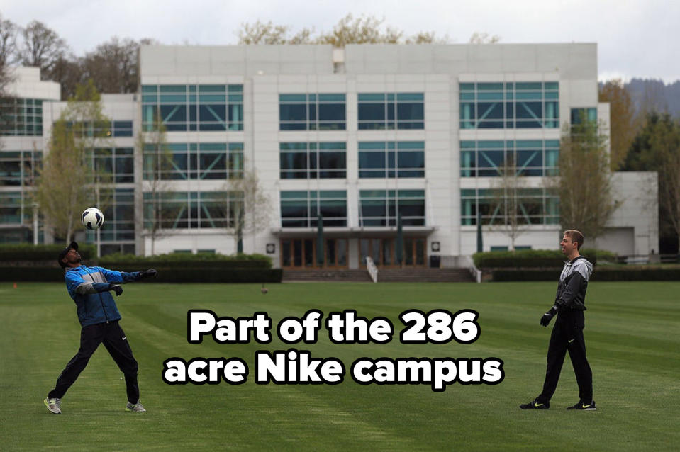 people playing soccer on a field at the 286 acre Nike campus