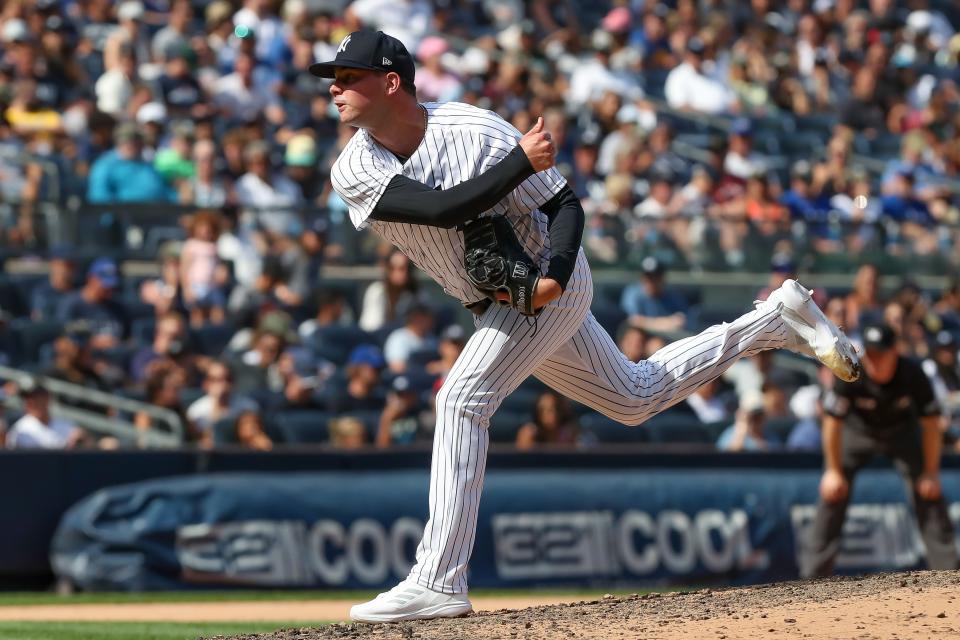 Aug 20, 2022; Bronx, New York, USA; New York Yankees relief pitcher Scott Effross (59) pitches the ball during the eighth inning against the Toronto Blue Jays at Yankee Stadium. Mandatory Credit: Tom Horak-USA TODAY Sports