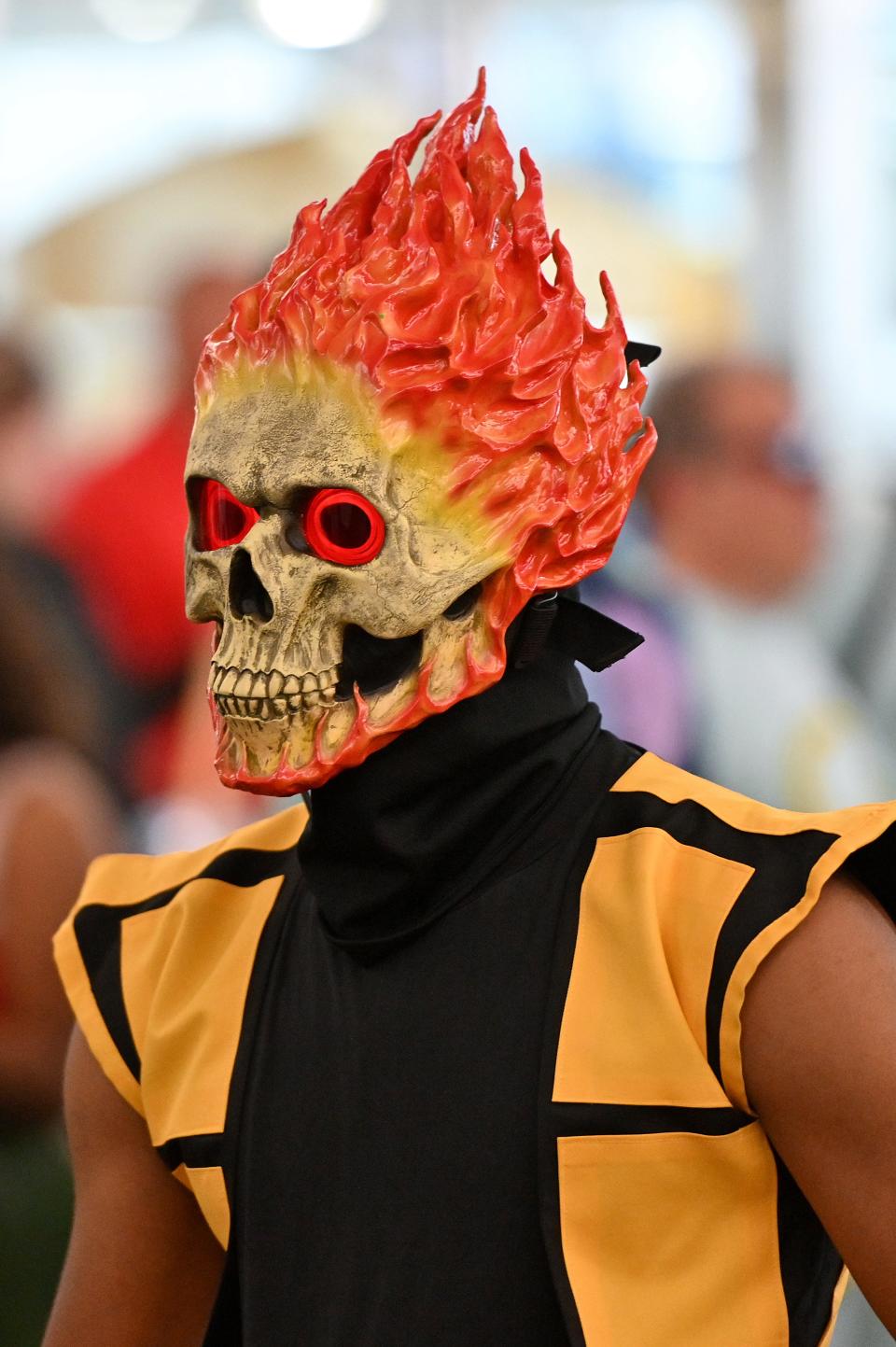 A cosplayer dressed as Scorpion from Mortal Kombat attends New York Comic Con 2019 on Oct. 6, 2019 in New York City.