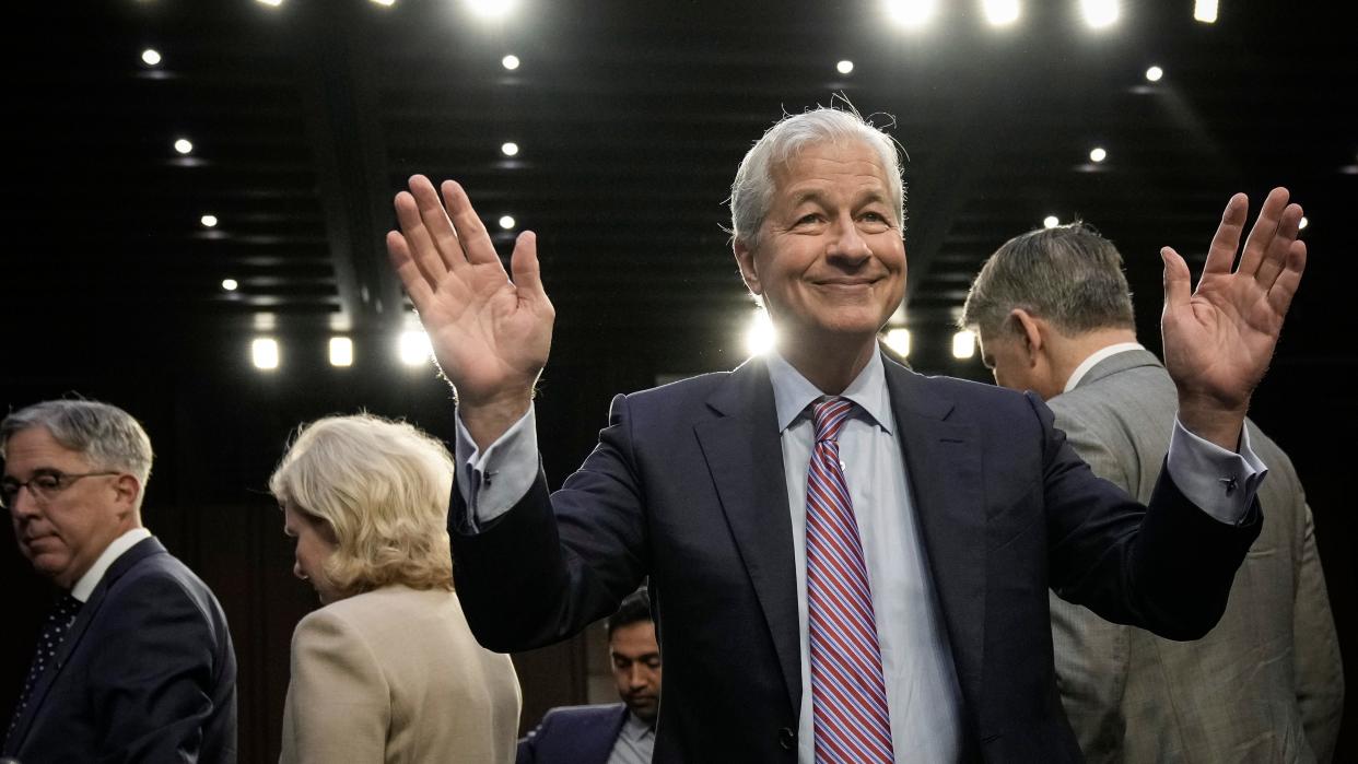 JPMorgan Chase & Co CEO Jamie Dimon gestures as he arrives for a Senate Banking