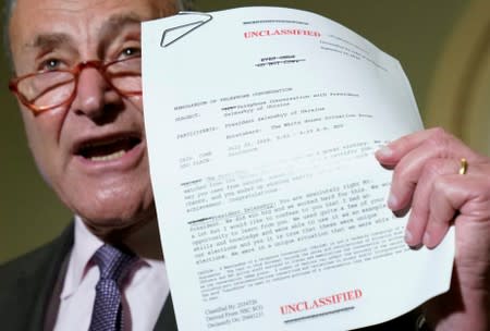 Chuck Schumer holds up a copy of the telephone conversation between Trump and Ukraine President Volodymyr Zelenskiy in Washington