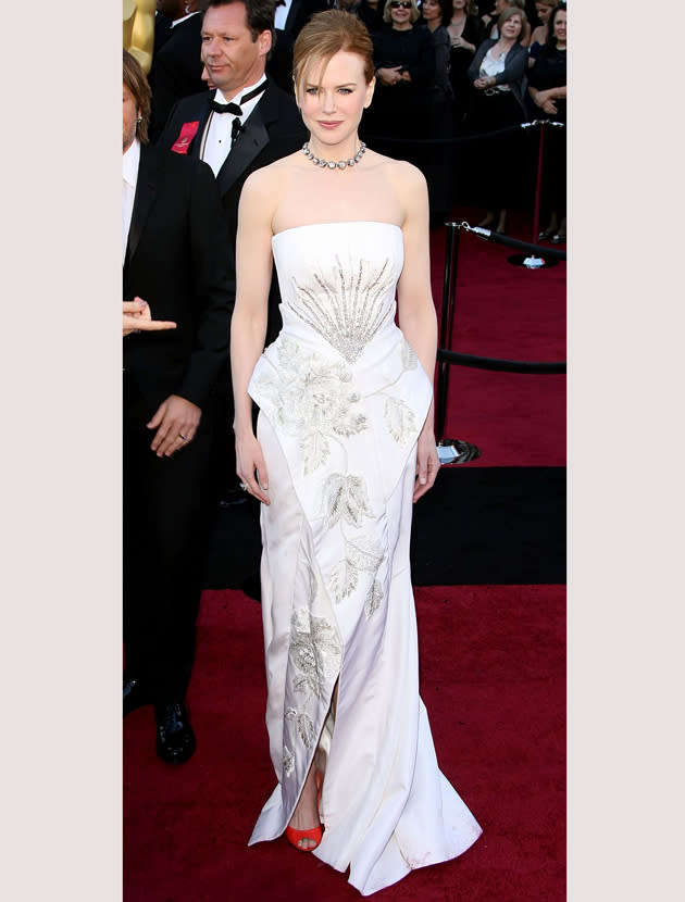 Oscars 2011 photos: Nicole Kidman wowed in a white Dior dress accented with red peep toe heels.