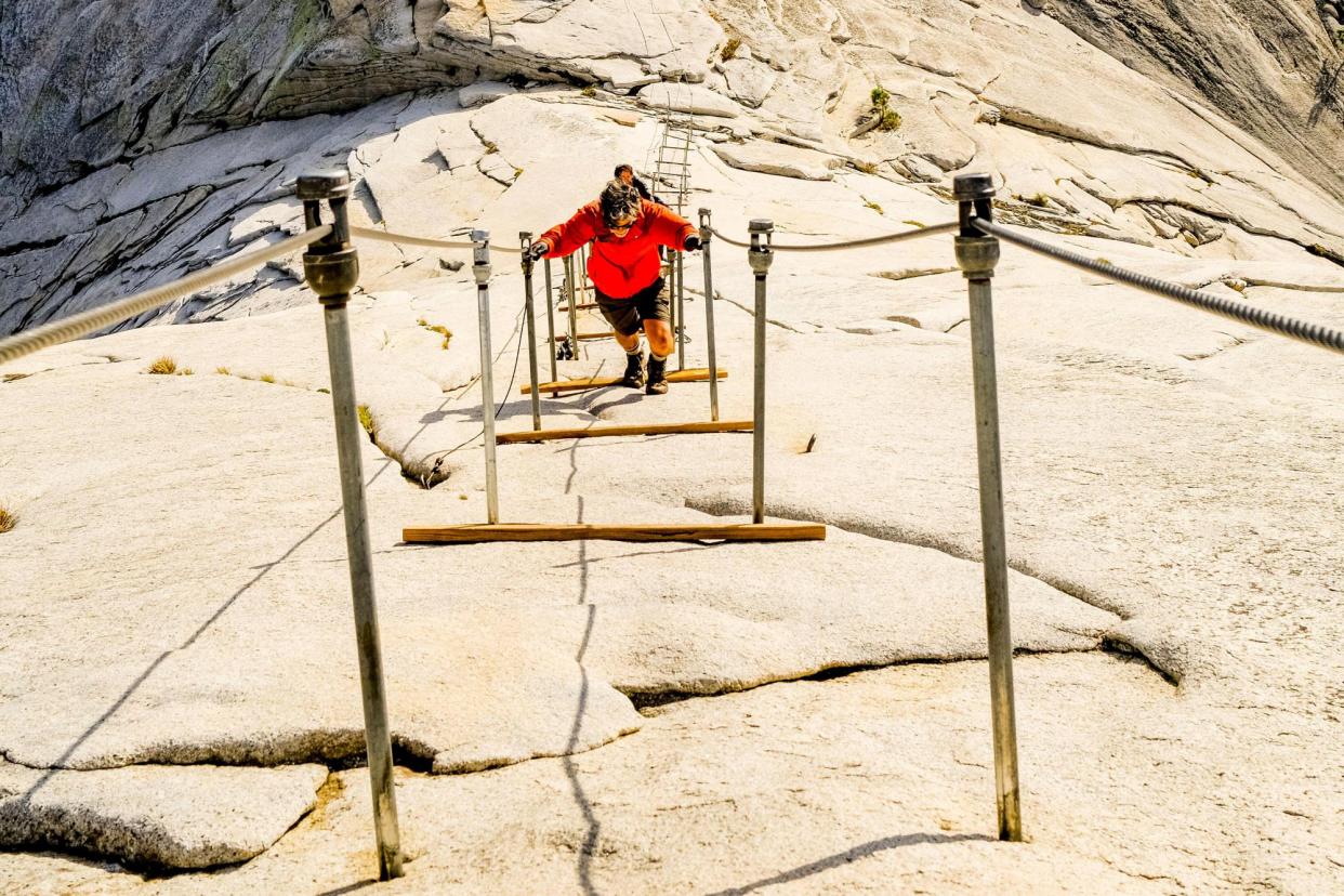 <span>Grace Rohloff’s father, Jonathan, has suggested the park should install more wooden slats on Half Dome to help people navigate the steep granite.</span><span>Photograph: Cavan Images/Alamy</span>