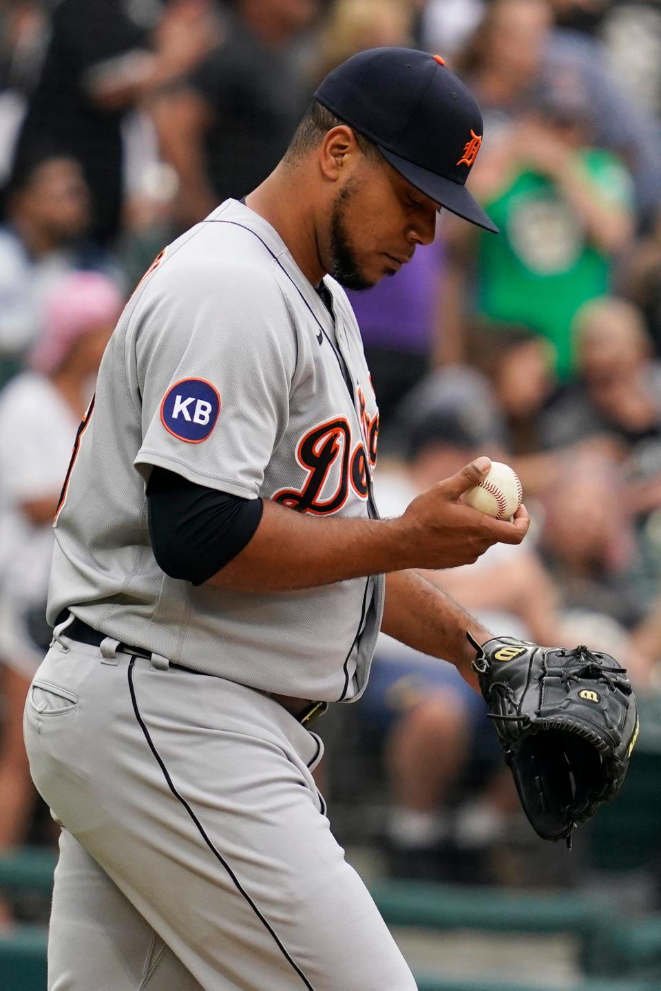 Tigers pitcher Wily Peralta looks at the ball after White Sox catcher Seby Zavala hit an RBI double during the eighth inning of the Tigers' 5-3 loss on Sunday, Aug. 14, 2022, in Chicago.