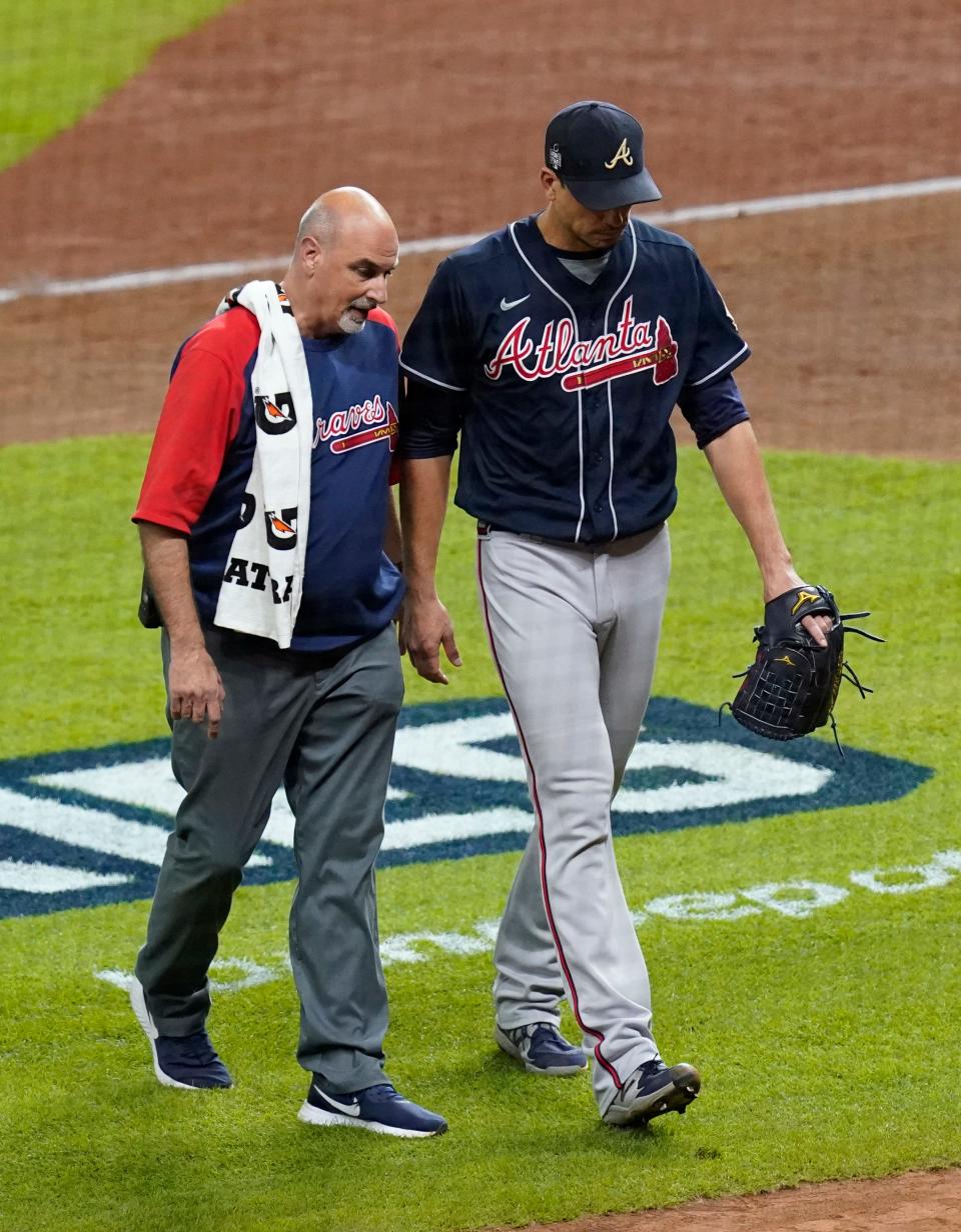 Braves starting pitcher Charlie Morton is removed after sustaining an injury in the third inning.