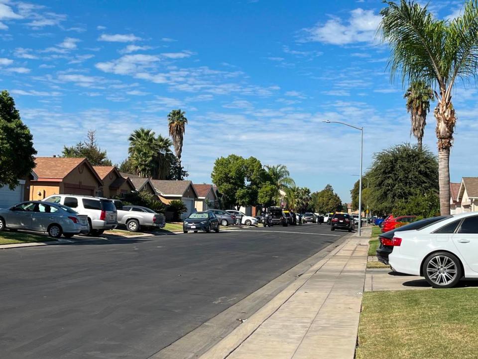 Fresno police blocked off East Harvest Lane as SWAT officers negotiated with someone in a home on the morning of Sunday, Sept. 25, 2022.