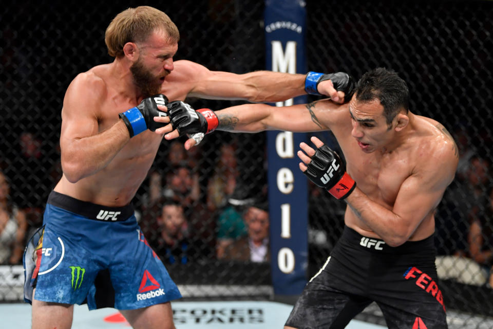 CHICAGO, IL - JUNE 08:  (L-R) Donald Cerrone punches Tony Ferguson in their lightweight bout during the UFC 238 event at the United Center on June 8, 2019 in Chicago, Illinois. (Photo by Jeff Bottari/Zuffa LLC/Zuffa LLC via Getty Images)