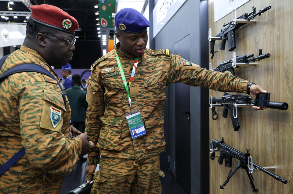 Members of delegations examine a weapon exhibition on the sideline of the Russia Africa Summit in St. Petersburg, Russia, Friday, July 28, 2023. (Yegor Aleyev/TASS Host Photo Agency Pool Photo via AP)