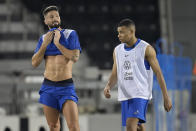 France's Kylian Mbappe, right, practises with Olivier Giroud, during a training session at the Jassim Bin Hamad stadium in Doha, Qatar, Friday, Dec. 2, 2022. France will play in the World Cup against Poland on Dec. 4. (AP Photo/Christophe Ena)