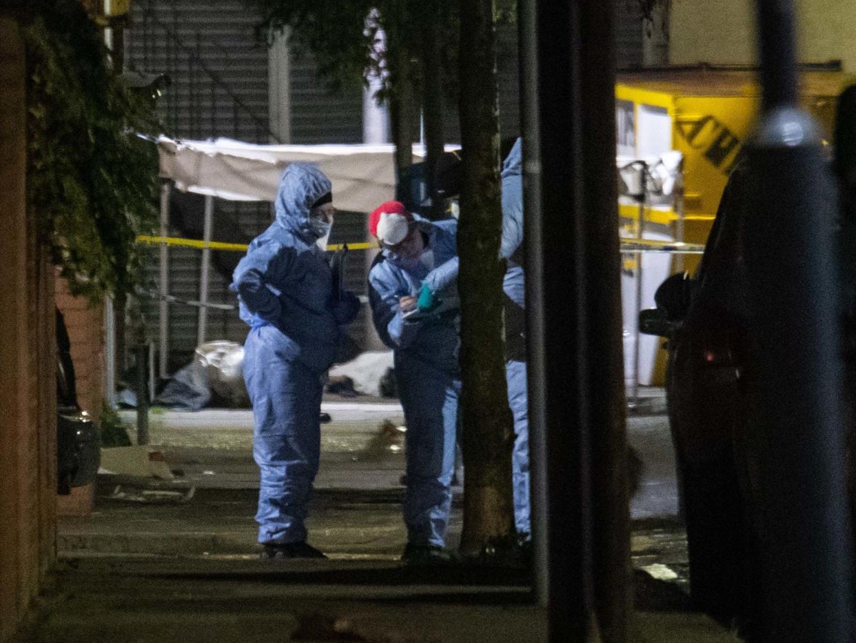 Forensics officers in Seven Kings, Ilford, after a multiple stabbing: PA