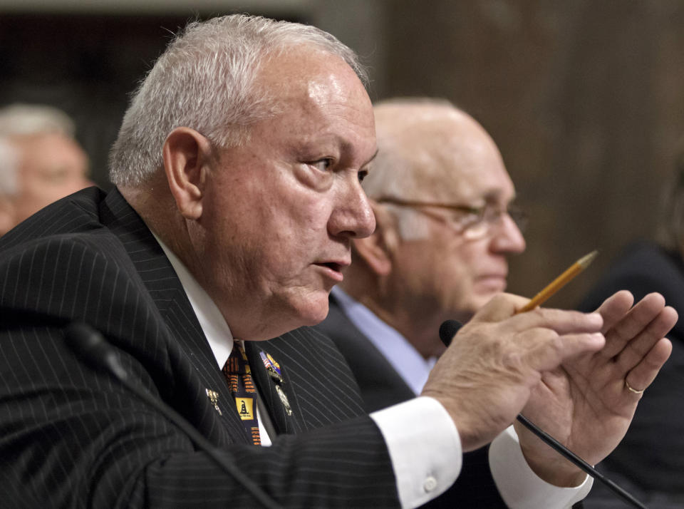 FILE - Former Arizona state Sen. Russell Pearce, the architect of Arizona's controversial immigration law S.B. 1070, left, accompanied by former Arizona Sen. Dennis DeConcini, testifies on Capitol Hill on April 24, 2012, in Washington before the Senate Immigration, Refugees and Border Security subcommittee hearing. Pearce, a Republican lawmaker who was the driving force behind Arizona's landmark 2010 immigration legislation known as the “show me your papers” law and other anti-immigrant measures, has died Thursday, Jan. 5, 2023. He was 75. (AP Photo/J. Scott Applewhite, File)