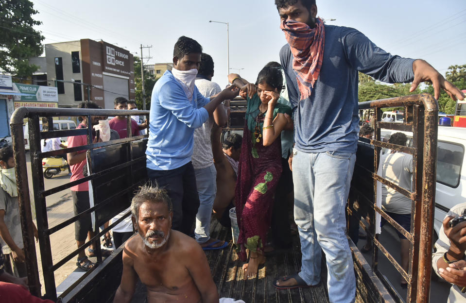 People affected by a chemical gas leak are carried out of a truck to an ambulance in Vishakhapatnam, India, Thursday, May 7, 2020. Chemical gas leaked from an industrial plant in southern India early Thursday, leaving people struggling to breathe and collapsing in the streets as they tried to flee. Administrator Vinay Chand said several people fainted on the road and were rushed to a hospital. (AP Photo)