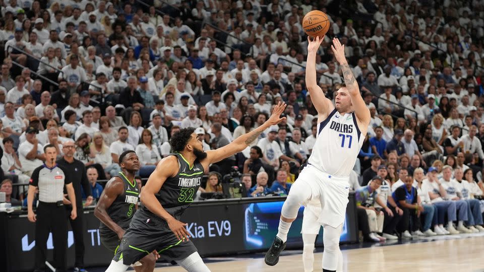 Dallas Mavericks guard Luka Dončić shoots over Minnesota Timberwolves center Karl-Anthony Towns during Game 5 of the Western Conference finals. - Abbie Parr/AP