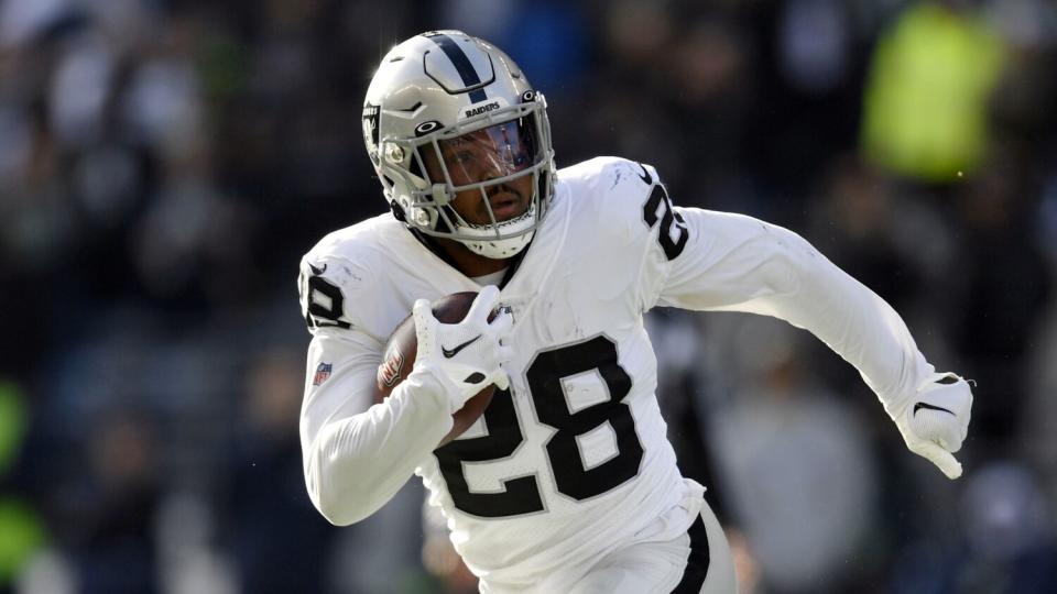 Las Vegas Raiders running back Josh Jacobs carries the ball against the Seattle Seahawks.