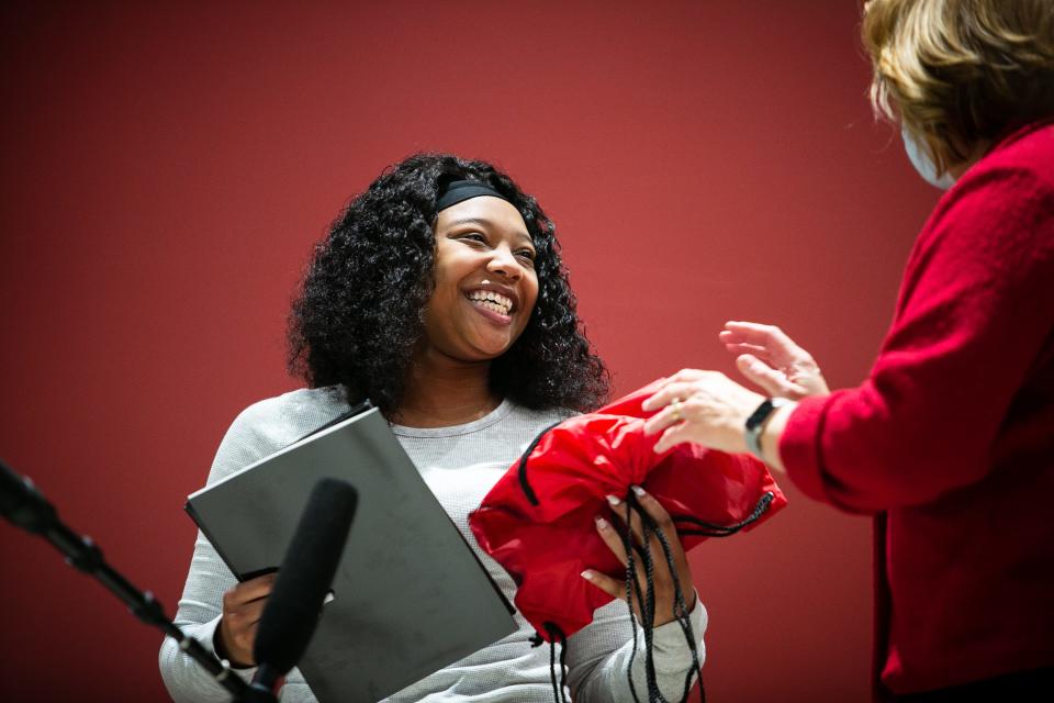 Lachelle Dixon, a Butler Tech Bioscience Center student, was surprised by the Bearcat mascot and other University of Cincinnati staff with news of her admissions to UC, on Monday, Jan. 24, 2022. Most admitted students would find out in an email later Monday afternoon, but four future Bearcats were surprised at home or at school Monday by UC administrators, their high school counselors and principals and their families.