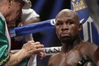 Floyd Mayweather Jr. sits in his corner during his WBC-WBA welterweight title boxing fight against Marcos Maidana Saturday, May 3, 2014, in Las Vegas. (AP Photo/Isaac Brekken)