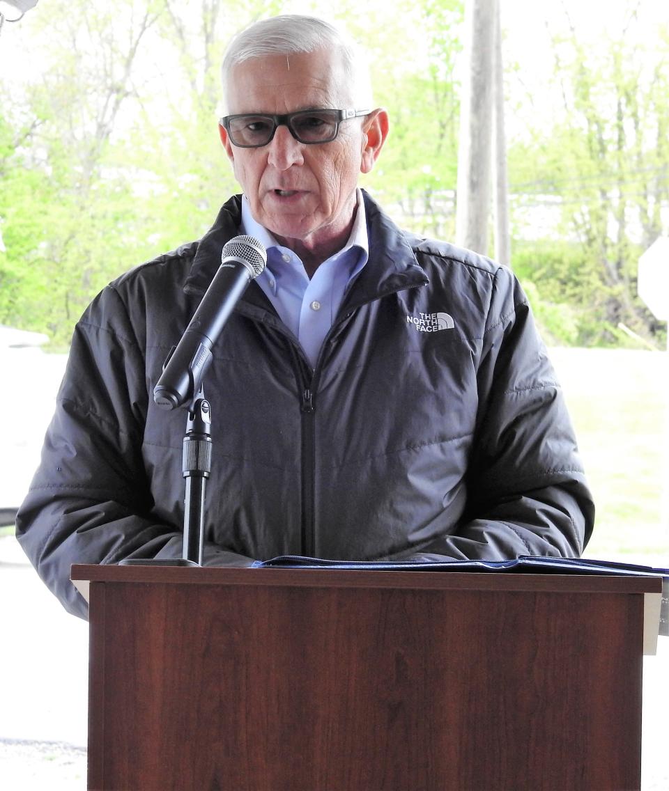 Dane Shryock speaks at a dedication ceremony for Skip's Landing. The former Skip's Refuse site has been turned into a community park that will host the Coshocton Farmers Market and other activities.