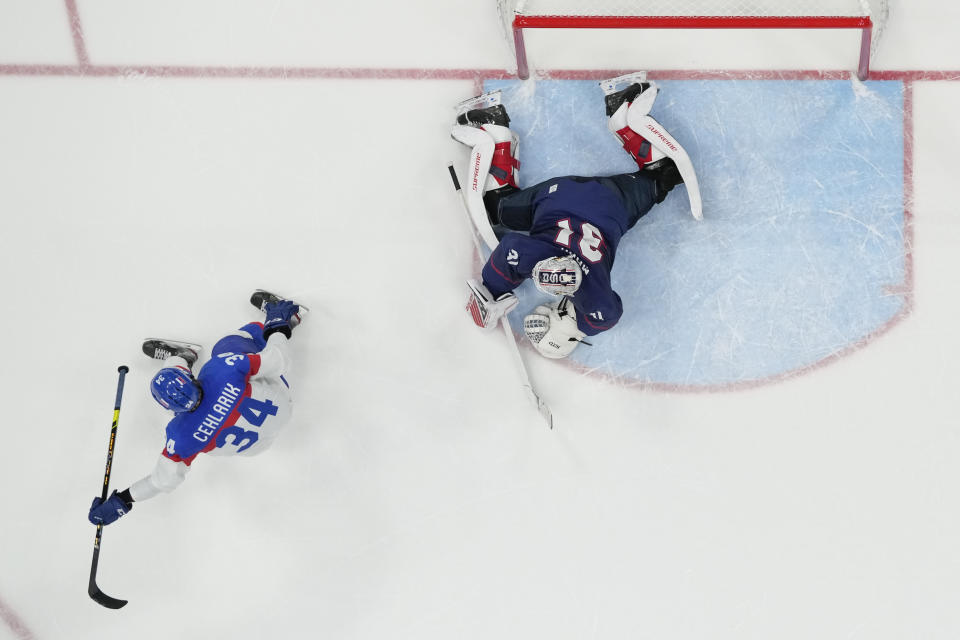 Slovakia's Peter Cehlarik (34) celebrates after scoring the winning goal past United States goalkeeper Strauss Mann (31) during a shoot-out in a men's quarterfinal hockey game at the 2022 Winter Olympics, Wednesday, Feb. 16, 2022, in Beijing. Slovakia won 3-2. (AP Photo/Matt Slocum)