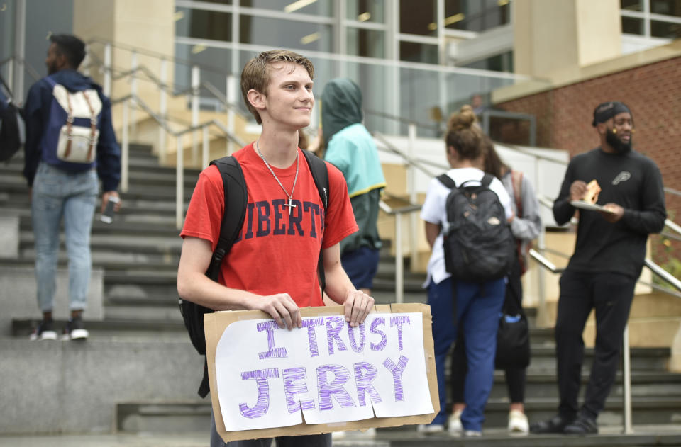 Garreidy Hamilton, a freshman in government politics and policy holds a sign saying "I trust Jerry" during a student protest Liberty University in Lynchburg, Va., Friday, Sept. 13, 2019. (Taylor Irby/The News & Advance via AP)