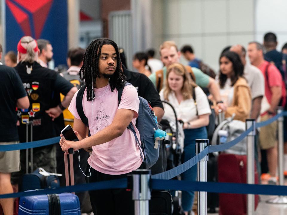 Travelers are seen ahead of the fourth of July holiday weekend at Hartsfield-Jackson Atlanta International Airport on June 30, 2023.