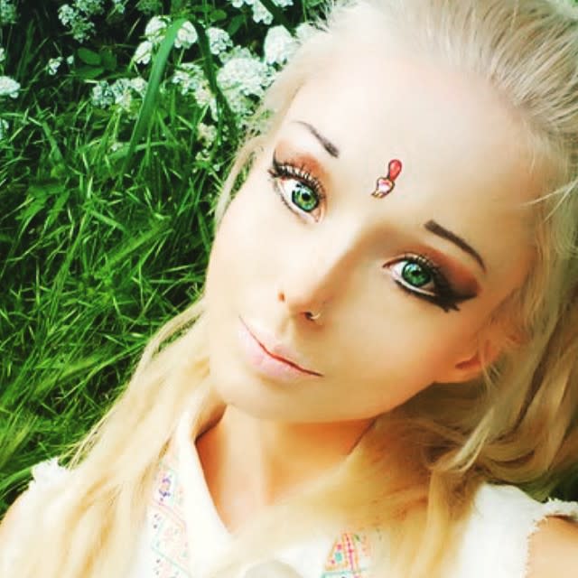 Over the last few years model Valeria Lukyanova has become an Internet celebrity for her often-criticized appearance, as she's popularly referred to as the "Human Barbie." Recently, Lukyanova -- who now goes by the name Amatue -- agreed to a Skype interview with Cosmopolitan where she opened up about her life, the strange mystique she's built up around herself, and her popular nickname. <strong>NEWS: 'Human Barbie' Valeria Lukyanova Fires Back at Haters With Most Shocking Photos Yet </strong> "I don't think they are right," she said, when asked what she thought about people referring to her as “Human Barbie.” "I think it's even a little degrading and insulting, but I'm used to it now, since that's what my work demands and this is precisely the image most fans request. So I have to comply with it because it's become part of my aesthetic image, but I don't like it." Despite not liking the "degrading" moniker, she often tags her own photos with #Barbie. According to Lukyanova, this is so that she can easily be found online. <strong>PHOTOS: Hollywood's Hottest Bikini Bods! </strong> "When people look for me, they look for me with that hashtag," she explained. "I'm the most popular [Barbie] copy in the world. When people say 'Barbie,' it's clear that it's associated with me, not anyone else. So that's why I use that hashtag — so people can find me this way." The Eastern European model's tiny waist, disproportionately large bust, long blonde hair and intricate makeup have generated a lot of controversy among people who claim the images are Photoshopped and/or blame Lukyanova for perpetuating stereotypes and impossible beauty standards. In May, Lukyanova posted a message to her critics online, along with new photos that were some of the model's most controversial yet. Despite claiming that she doesn't alter her photos -- and that the only surgery she's had is breast implants -- Lukyanova did later admit that the pictures she posted that day had been altered, but she argued that it was mostly "color correction." In her interview with Cosmo, Lukyanova concluded with a message of love, aimed at those who say she perpetuates a negative body image for young girls. "I want to wish for everyone to learn to love themselves. And when they learn to love themselves, they will be loved by others." <strong>WATCH: Jennifer Lawrence Reveals 'Barbie Girl' is the Soundtrack to Her Life </strong>