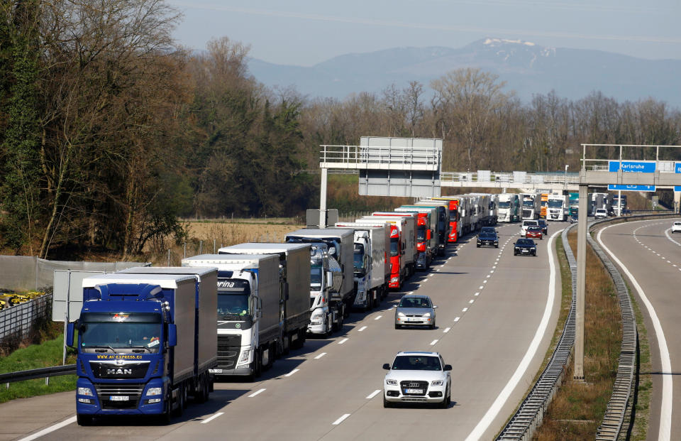 Trucks are parked on the German Autobahn A5 motorway near the German-Swiss border after Germany announced border controls, as the country faces an aggressive progression of the coronavirus disease (COVID-19), in Weil am Rhein, Germany, March 16, 2020. REUTERS/Arnd Wiegmann