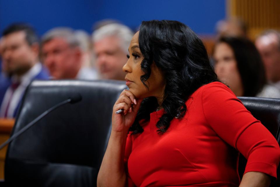 Fulton County District Attorney Fani Willis listens during the final arguments in her disqualification hearing at the Fulton County Courthouse on March 1, 2024, in Atlanta, Georgia. Fulton County Superior Judge Scott McAfee is considering a motion to disqualify Willis over her romantic relationship with Special Prosecutor Nathan Wade, whom she appointed as special prosecutor in the election interference charges against former Trump. (Photo by Alex Slitz / POOL / AFP) (Photo by ALEX SLITZ/POOL/AFP via Getty Images) ORG XMIT: 776022538 ORIG FILE ID: 2043988805