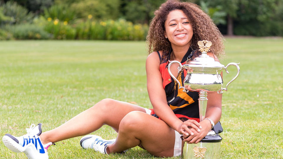 Naomi Osaka, pictured here with the Daphne Akhurst Memorial Trophy after winning the 2021 Australian Open.