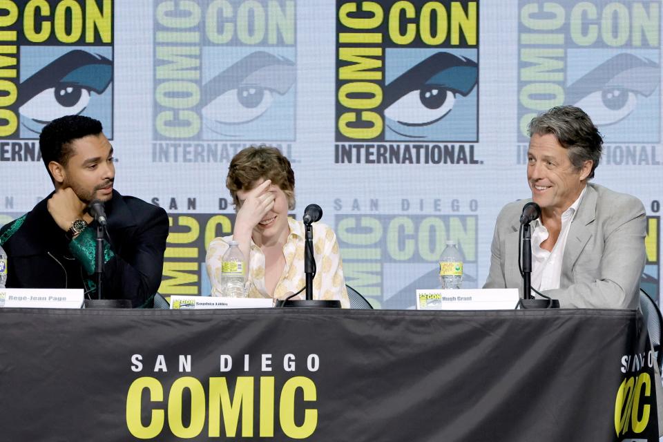 Regé-Jean Page, Sophia Lillis, and Hugh Grant speak onstage at the "Dungeons & Dragons: Honor Among Thieves" panel during 2022 Comic-Con International: San Diego at San Diego Convention Center on July 21, 2022 in San Diego, California.