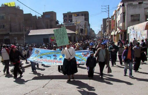 Protesters, mostly highland Aymara indigenous farmers, march in a fresh wave of protests in Juliaca, 1,400 kms southeast of Lima in the Puno region, on June 24. Peru suspended a Canadian company's mining project in the south of the country on Saturday, following intense negotiations in the wake of deadly protests by mostly indigenous anti-mining activists, authorities said