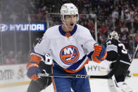 New York Islanders' Pierre Engvall reacts after assisting on a goal by Jean-Gabriel Pageau during the first period of an NHL hockey game against the New Jersey Devils in Newark, N.J., Monday, April 15, 2024. (AP Photo/Seth Wenig)