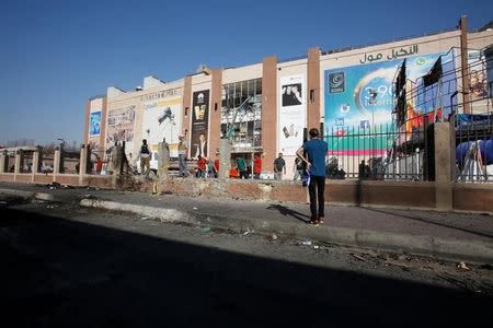 A man stands at the site of a suicide bomb attack at Nakheel Mall across from the oil ministry, in Baghdad, in Iraq September 10, 2016. REUTERS/Khalid al Mousily