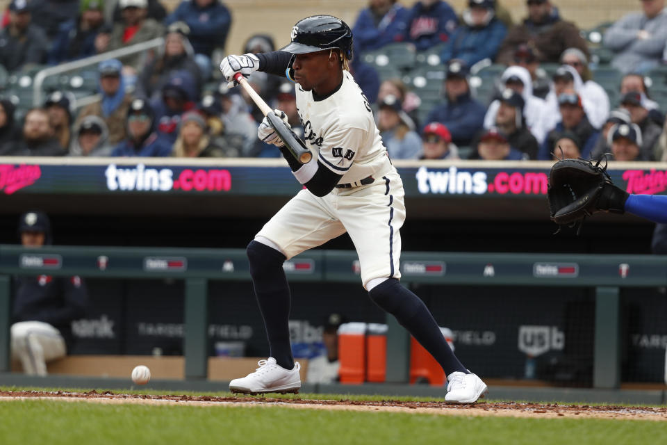 Minnesota Twins' Nick Gordon lays down a squeeze bunt to score Byron Buxton against the Kansas City Royals in the second inning of a baseball game, Sunday, April 30, 2023, in Minneapolis. (AP Photo/Bruce Kluckhohn)