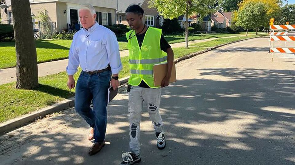 John King accompanies Devonta Johnson, a canvasser with the group Black Leaders Organizing for Communities, on a door-knocking shift in Milwaukee in October. - CNN