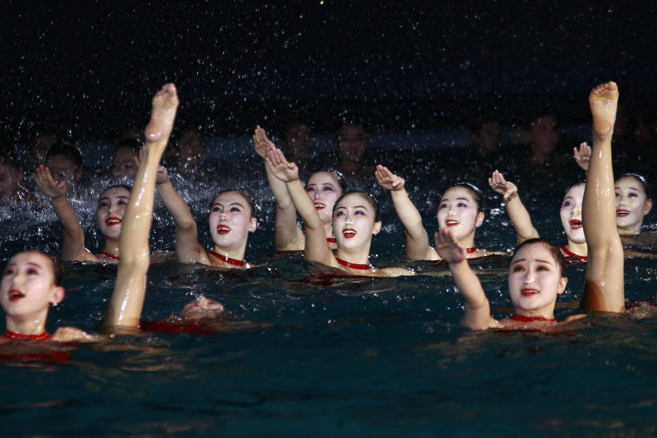 A group of synchronized swimmers perform celebrating the Day of Shining Star on the occasion of the 80th birth anniversary of former North Korean leader Kim Jong Il at the swimming gymnasium in Pyongyang, North Korea, Sunday, Feb. 13, 2022. (AP Photo/Cha Song Ho)