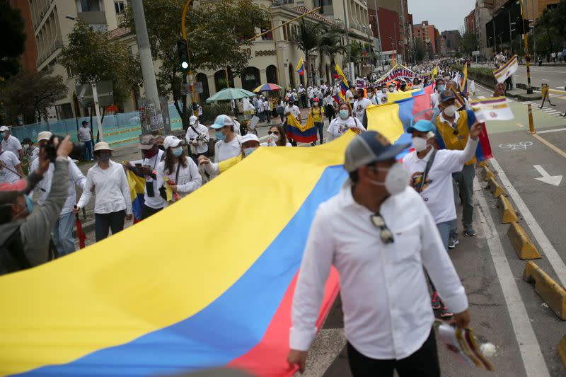 People march against road blockades in Bogota