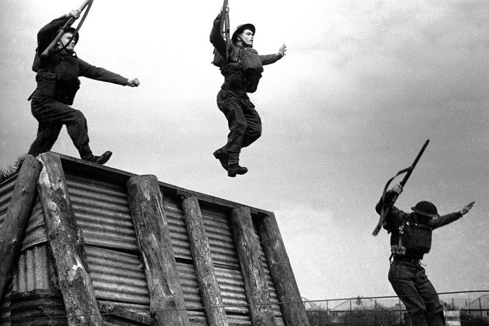 Photo of three soldiers during army training taken on May 1, 1942.