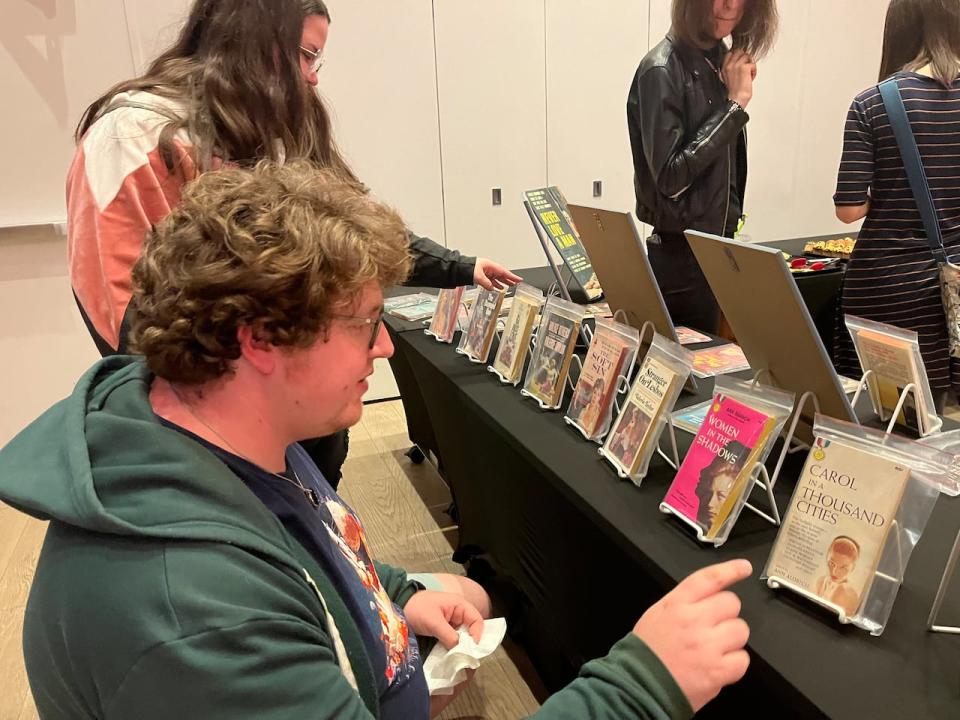 Nadia Champion and Phillip Gnemmi attended Wednesday's event and were looking at the many books presented on a table to the side.